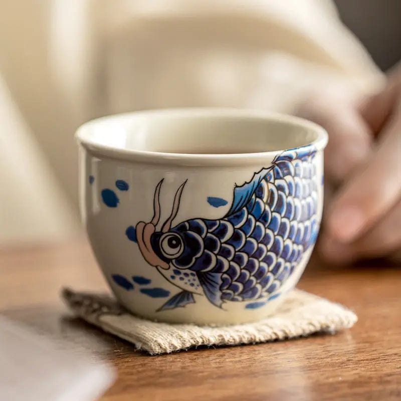 Porseleinen theekopje met karpermotief 120 ml