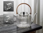 Glazen theepot 1 liter met infuser en houten handgreep
