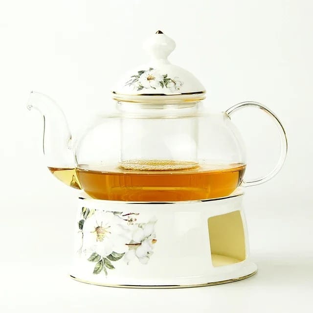 Glazen theepot met warmhouder