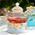 Glazen theepot met warmhouder 600 ml en blauwe bloemen – elegante theepotset