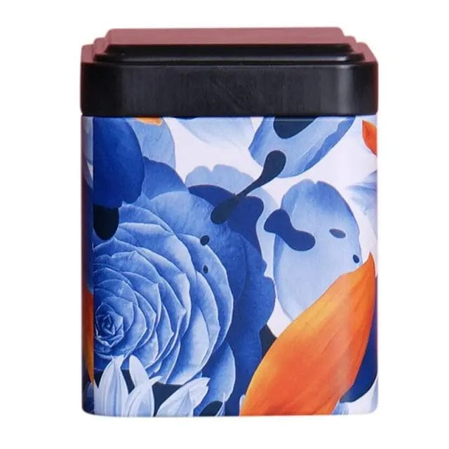 Zwarte metalen theedoos met blauwe bloemen